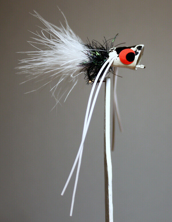 River Runt white body, black hackle, white tail and white rubber legs