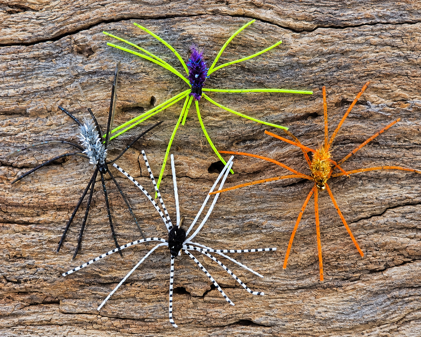 Woods Fuzzy Jigs Four Woods Fuzzy Jigs arranged on natural bark